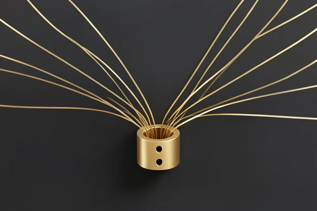 Many thin brass lines fanning out from a single small port, every connection forced through one narrow opening.